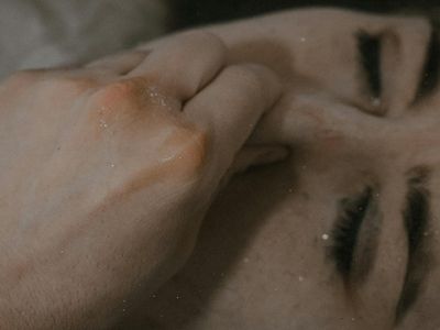 Close up of a woman's hands resting during meditation