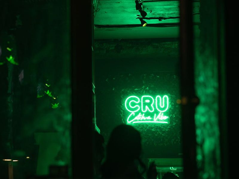 Minimalist exercise studio with soft green neon light bars